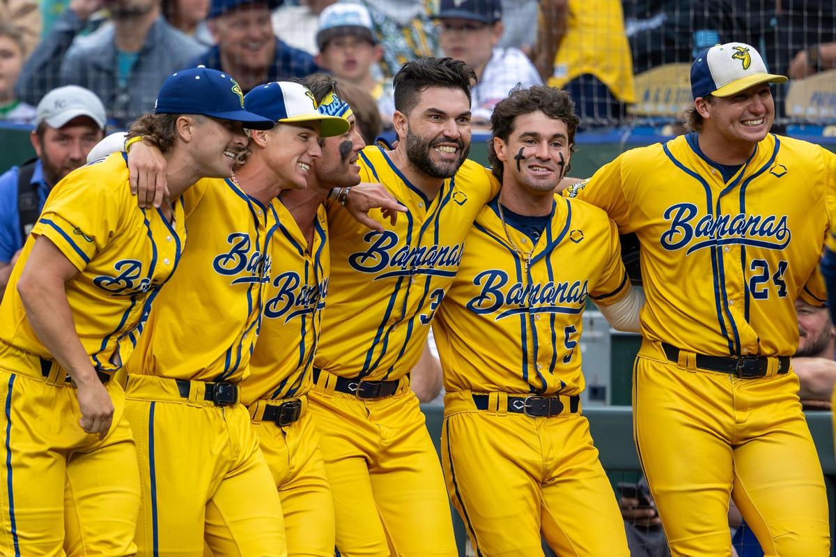 Former Kansas City Royals first baseman Eric Hosmer surprises fans during a dance routine with Savannah Bananas players during a Banana Ball game against the Firefighters at Kauffman Stadium on Friday, May 23, 2025, in Kansas City.