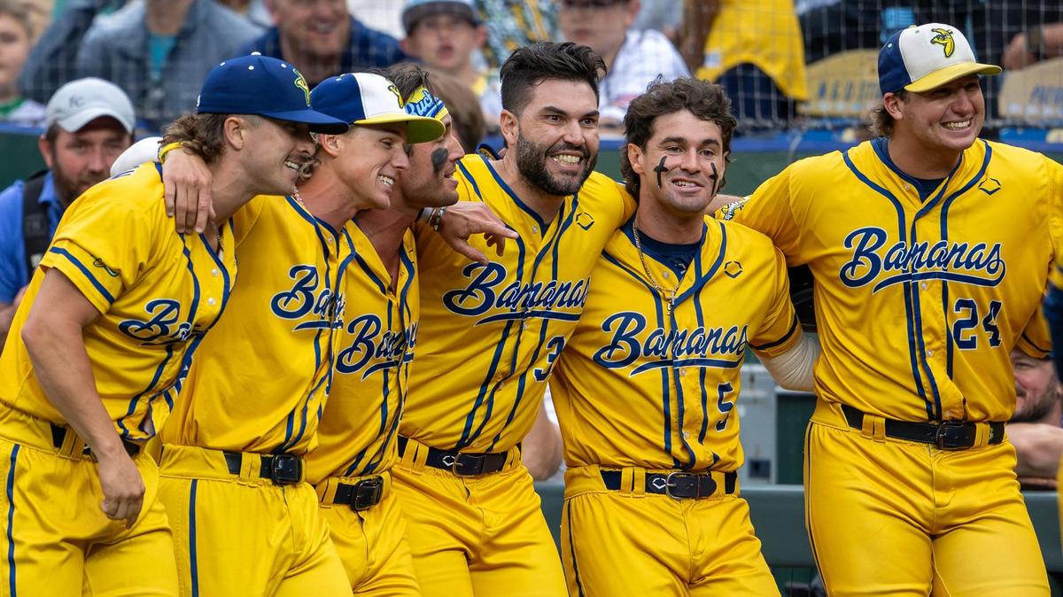 Former Kansas City Royals first baseman Eric Hosmer surprises fans during a dance routine with Savannah Bananas players during a Banana Ball game against the Firefighters at Kauffman Stadium on Friday, May 23, 2025, in Kansas City.