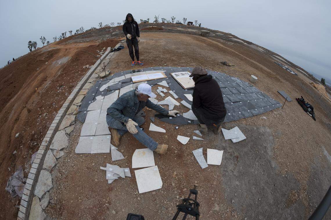 “Young Woman of China” utilizes marble, granite and the province’s natural stone. It also incorporates dirt, plants, rice paddies and other materials native to the region.