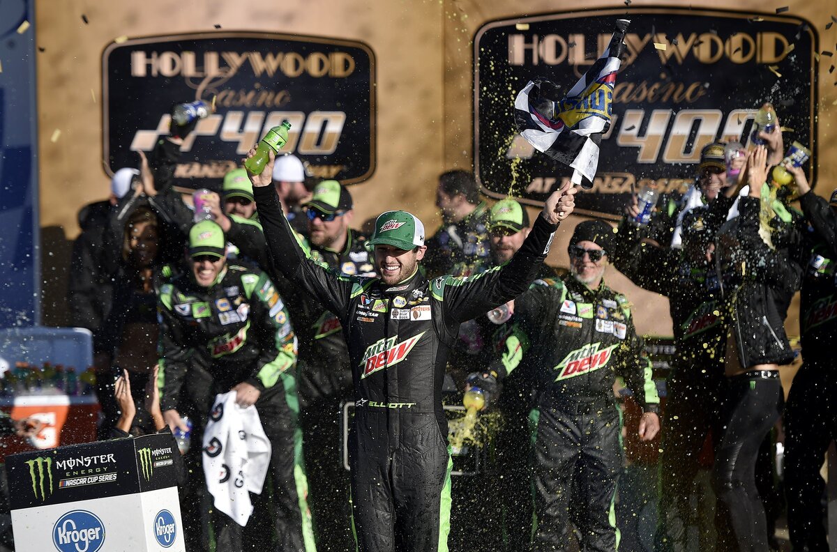 Chase Elliott and his team celebrate winning the Monster Energy NASCAR Cup Series Hollywood Casino 400 at Kansas Speedway Sunday.