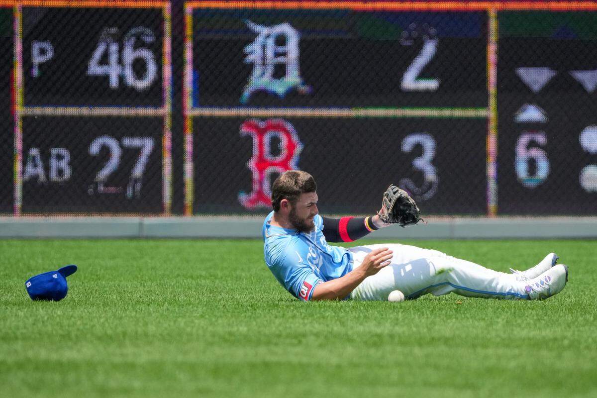 Kansas City Royals center fielder Kyle Isbel lies on the field at Kauffman Stadium after colliding with Bobby Witt Jr.’s left knee while chasing down a popup during Sunday’s game against the San Diego Padres.