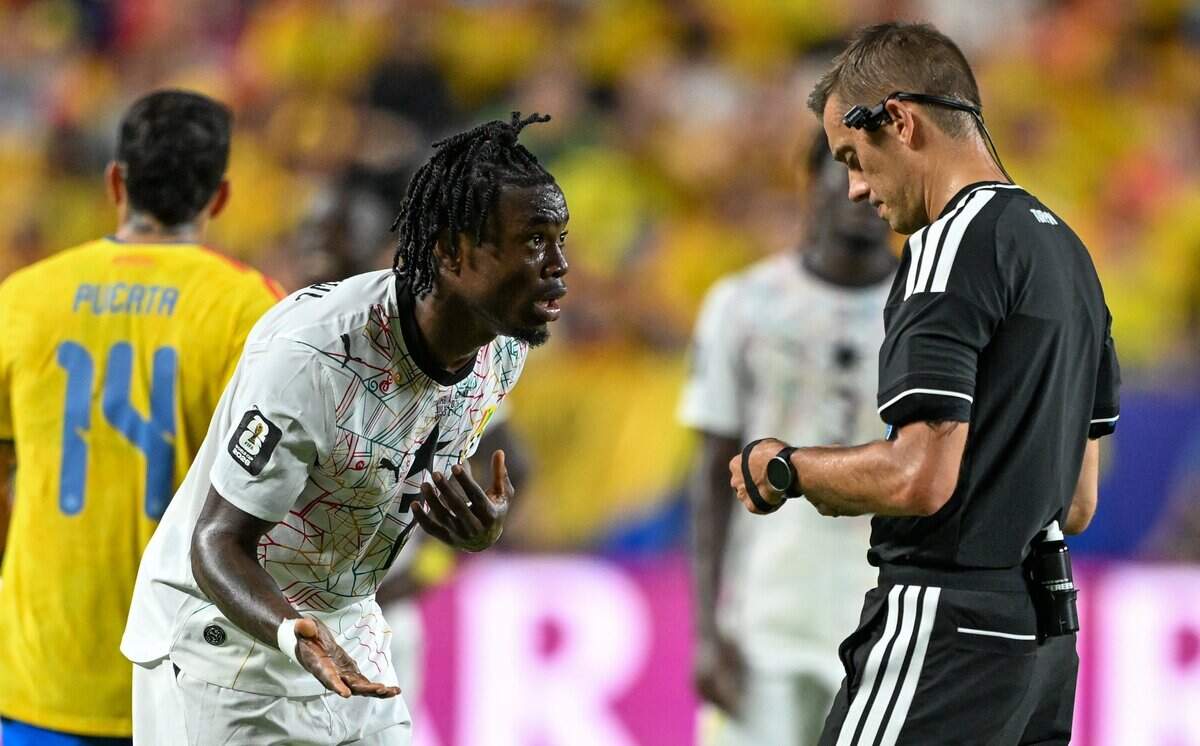 Ghana forward Abdul Fatawu (7) disagrees with the official as he is given a yellow card in the second half of the Colombia vs. Ghana 2026 World Cup Round of 32 football match at Kansas City (Arrowhead) Stadium in Kansas City on Friday, July 3, 2026.