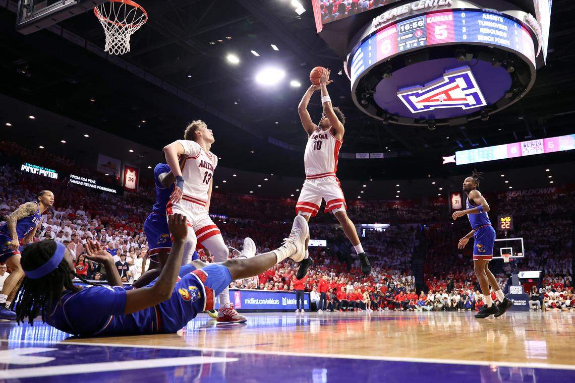 Koa Peat #10 of the Arizona Wildcats shoots the ball during the first half against the Kansas Jayhawks at McKale Center at ALKEME Arena on February 28, 2026 in Tucson, Arizona.