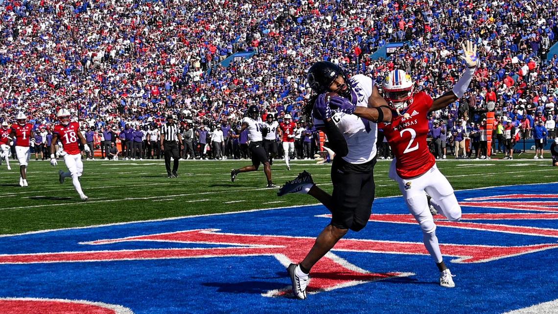 TCU Horned Frogs wide receiver Quentin Johnston (1) scored the winning touchdown in the fourth quarter despite attempts from Kansas Jayhawks cornerback Cobee Bryant at Booth Memorial Stadium on Saturday, Oct. 8, 2022, in Lawrence, Kansas. TCU defeated KU, 38-31, before a sold out crowd.