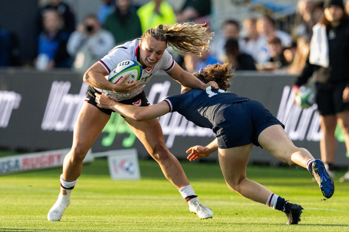 A Canadian player attempts to avoid a team USA player in the USA vs. Canada rugby match at CPKC Stadium on Friday, May 2, 2025. Canada won the match 26-14.