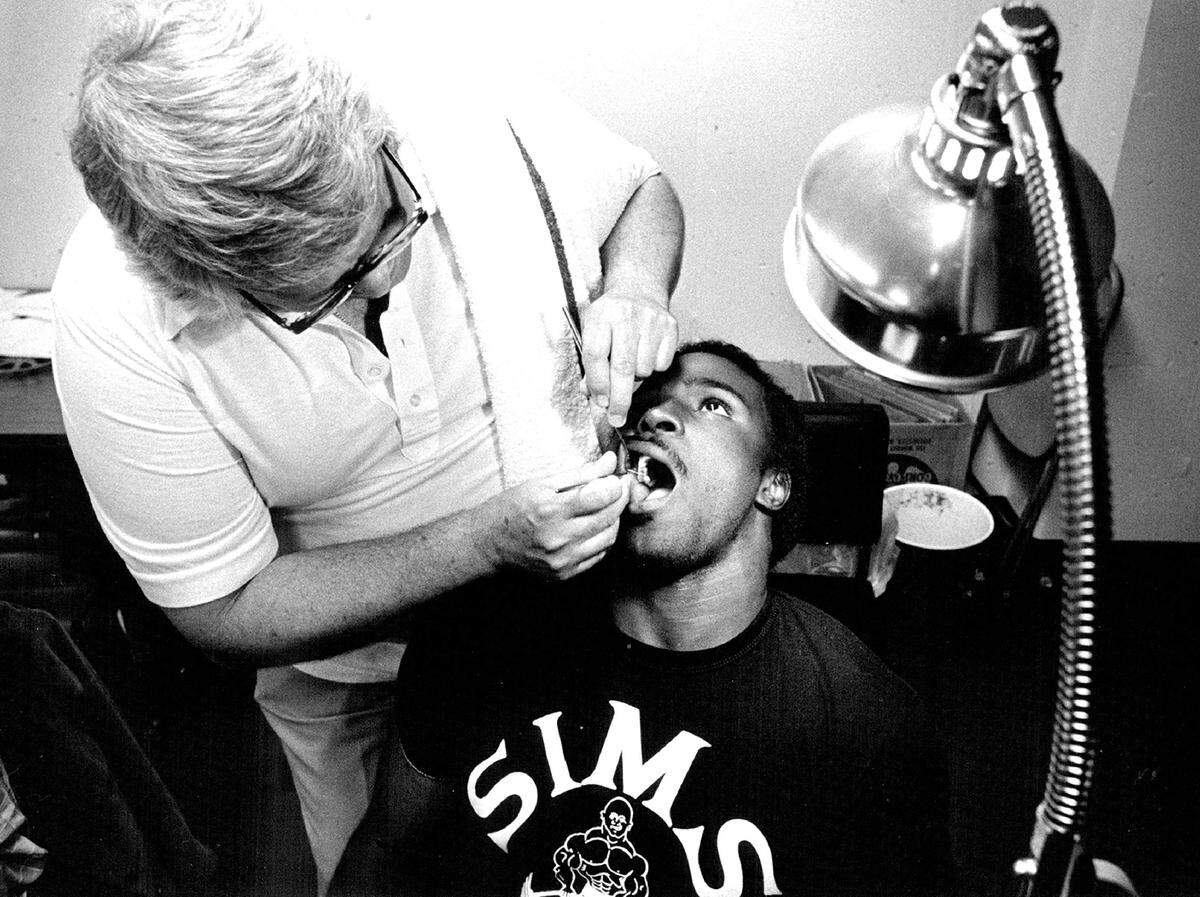 Chiefs rookie tight end Marvin Harvey undergoes a dental examination by Dr. Charles V. Brock, Chiefs’ team dentist in 1981.