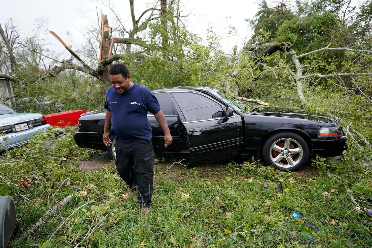 Reginald Duhon prepares to work at his home on Thursday, Aug. 27, 2020, in Lake Charles, La., after Hurricane Laura moved through the state. (AP Photo/Gerald Herbert)