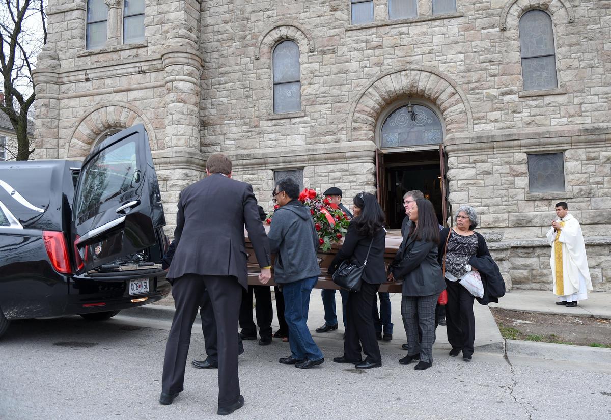 Family members carried the casket of Albert “Tic Toc” Tinoco out of Sacred Heart Guadalupe church after his funeral Monday. On that day, restrictions allowed only 10 people to attend. Starting Tuesday, funerals are banned.