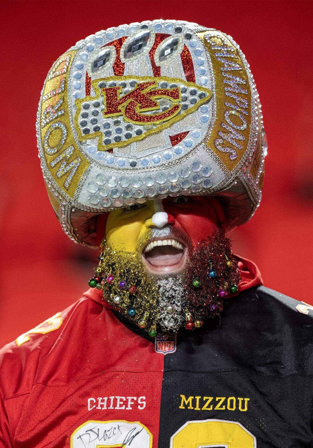 A Chiefs fan supported oversized Super Bowl ring hat before the game against the Houston Texans on Sunday, Dec. 7, 2025, at GEHA Field at Arrowhead Stadium in Kansas City.