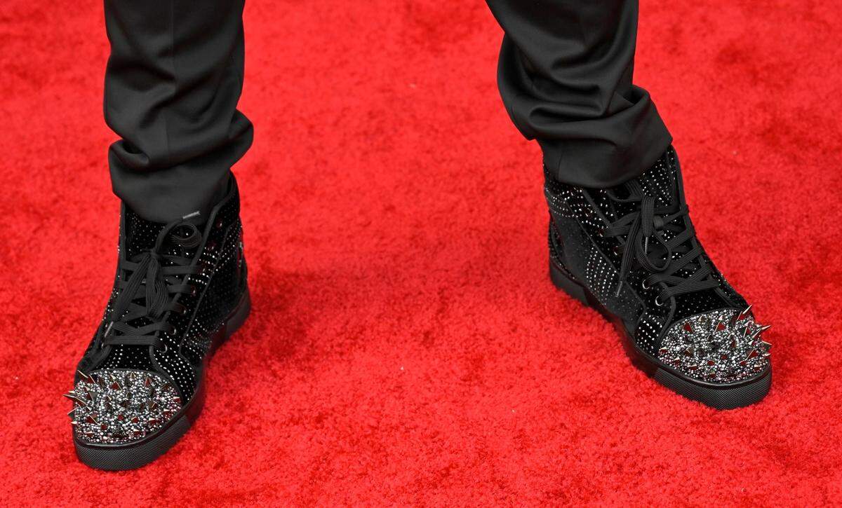 Isiah Pacheco wore $1,800 Christian Louboutin black suede and velvet high-tops with spiked toes.