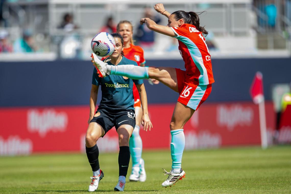 Kansas City Current midfielder Vanessa DiBernardo (16) clears the ball over Portland Thorns FC forward Adriana Leon (21) in the first half of an NWSL showdown at CPKC Stadium on Saturday, March 16, 2024, in Kansas City.