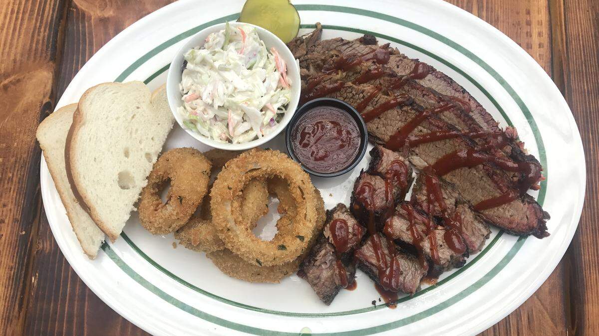 Luther’s Brisket Dinner with sliced smoked brisket, burnt ends and a choice of two sides such as onion rings and creamy coleslaw costs $20.
