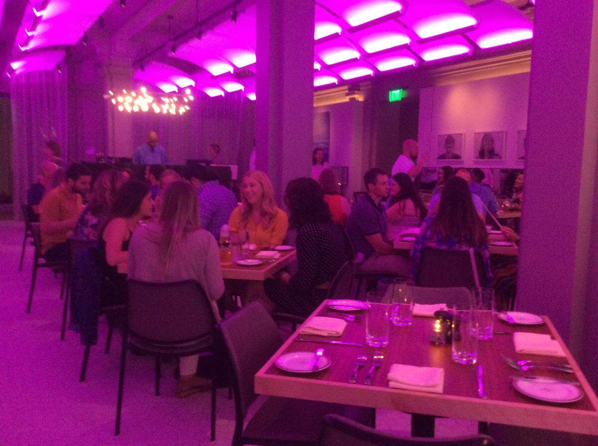 The Savoy's contemporary main dining room features overhead lighting "fins" that subtly change colors.