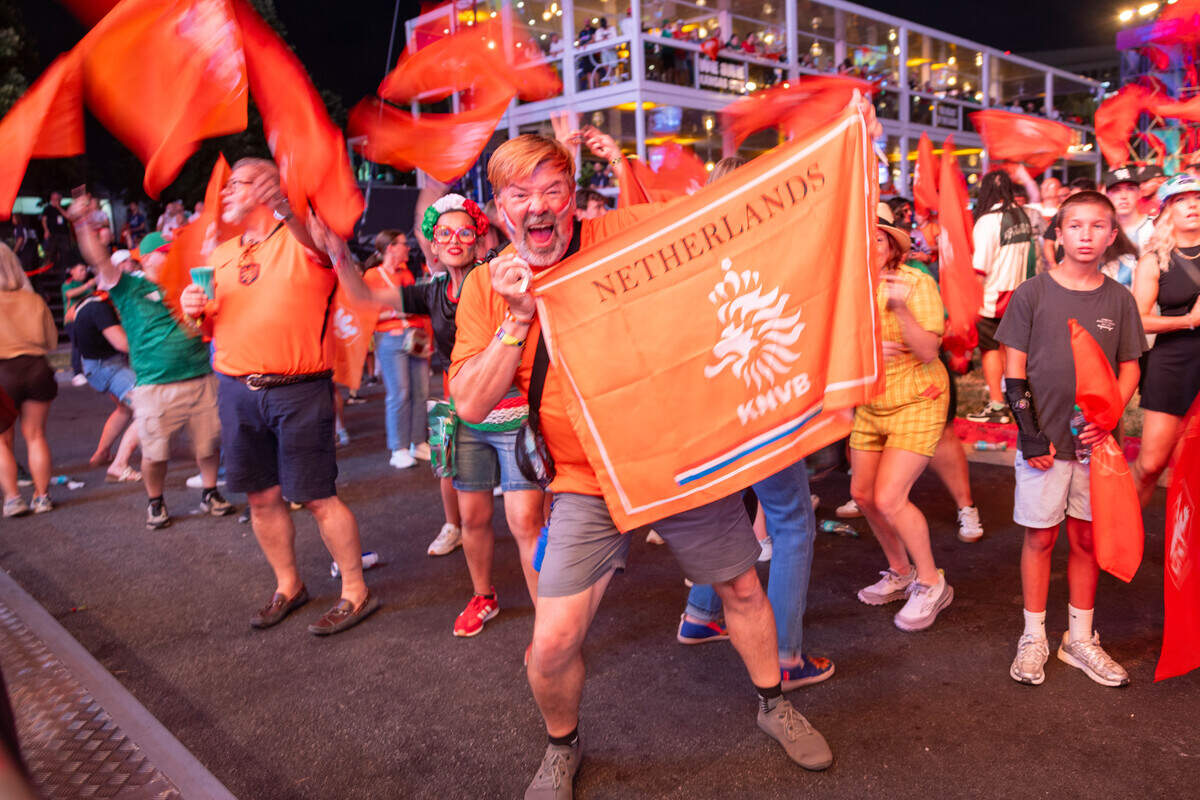 Dutch fans wave their flags and cheer as they celebrate their team during the Bij Oranje Party at Fan Fest on Wednesday, June 24, 2026.