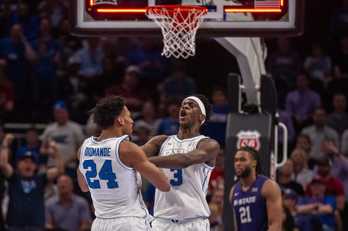 BYU Cougars forward AJ Dybantsa (3) shoves and shouts at teammate Dominique Diomande (24) after making a fast break dunk just before halftime of the Wildcats first round game vs. the BYU Cougars in the Big 12 Men's Basketball Tournament, on Tuesday, March 10, 2026, at T-Mobile Center. The Wildcats lost to BYU, 105-91.