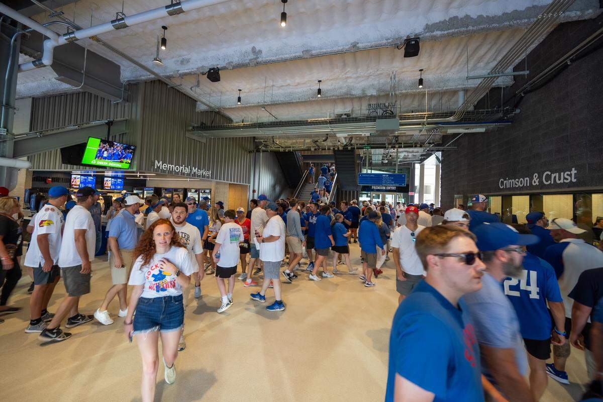 Fans move about the newly remodeled concourse inside David Booth Kansas Memorial Stadium prior to the Jayhawks game vs. the Fresno State Bulldogs on Saturday, Aug. 23, 2025, in Lawrence.