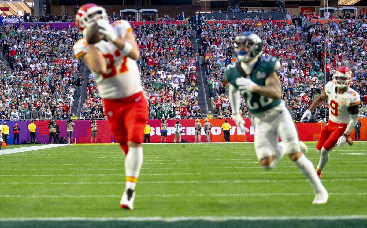 This first shot of Kansas City Chiefs tight end Travis Kelce catching a touchdown pass after burning Philadelphia Eagles safety Marcus Epps during the Super Bowl LVII was not usable. The lens was focused on the crowd at the other end of the field.