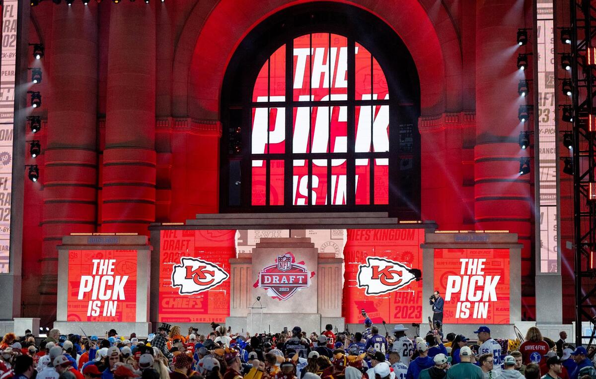 Football fans await the 55th pick of the NFL Draft by the Kansas City Chiefs during the second round of the draft outside of Union Station on Friday, April 28, 2023, in Kansas City.