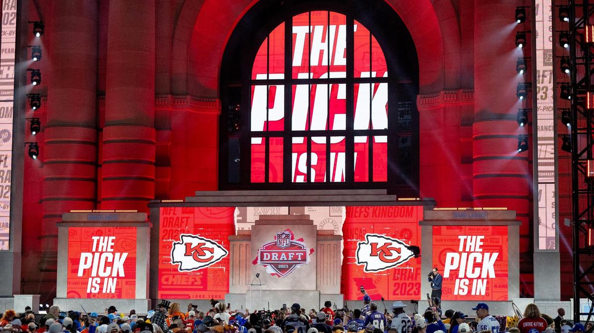 Football fans await the 55th pick of the NFL Draft by the Kansas City Chiefs during the second round of the draft outside of Union Station on Friday, April 28, 2023, in Kansas City.