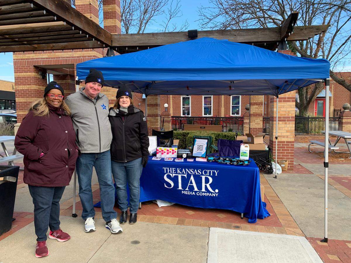 The Star’s Yvette Walker, Greg Farmer and Laura Bauer distribute naloxone and resource guides at the Overland Park Farmers’ Market.