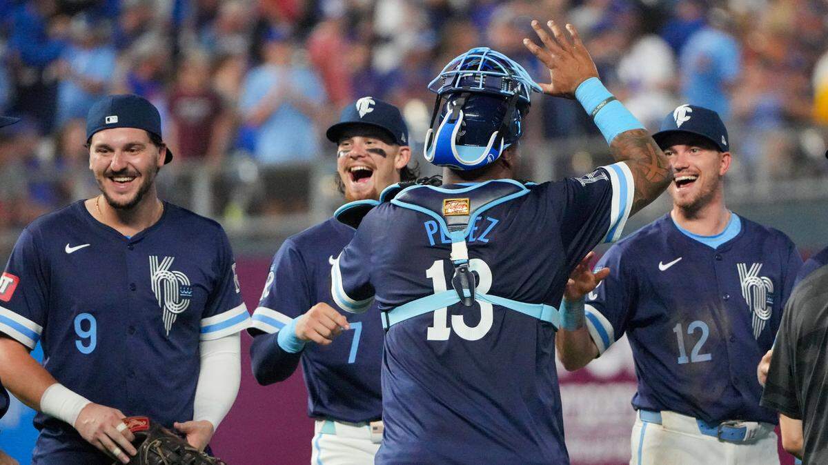 Kansas City Royals catcher Salvador Perez (13) celebrates with first baseman Vinnie Pasquantino (9), shortstop Bobby Witt Jr. (7) and third baseman Nick Loftin (12) after the win over the Chicago Cubs at Kauffman Stadium on July 26, 2024.