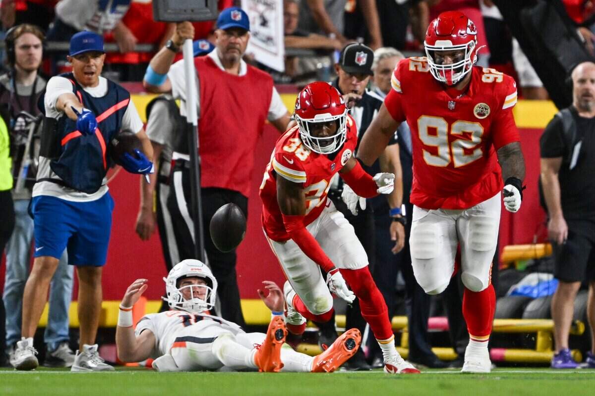Kansas City Chiefs cornerback L'jarius Sneed (38) and Kansas City Chiefs defensive tackle Khyiris Tonga (92) try to get to the loose ball in the Kansas City Chiefs vs. Denver Broncos NFL season opener at Arrowhead Stadium in Kansas City on Sept. 14, 2026.