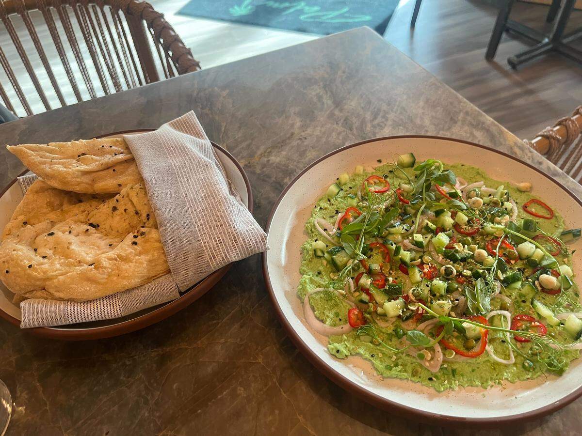 The spicy edamame hummus and nori flatbread are served at Palm Tree Club, 14 E. 14th St.