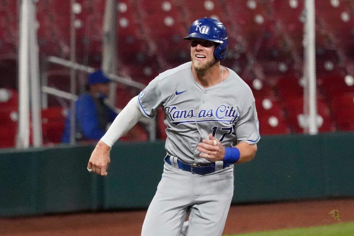Kansas City Royals’ Hunter Dozier runs home to score during the third inning of a baseball game against the St. Louis Cardinals Tuesday, Aug. 25, 2020, in St. Louis. (AP Photo/Jeff Roberson)