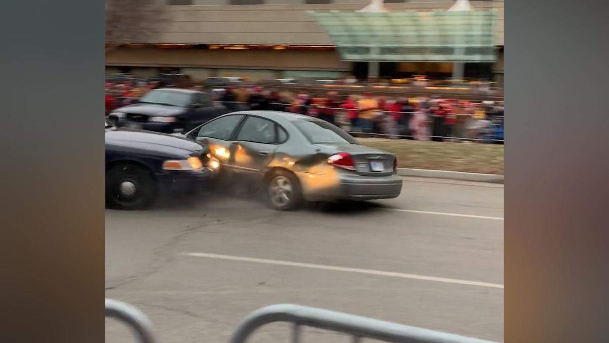 A car collides with a police cruiser after breaking through a barricade Wednesday on the parade route for the Kansas City Chiefs’ Super Bowl celebration downtown. The incident unfolded hours before the parade was to start.