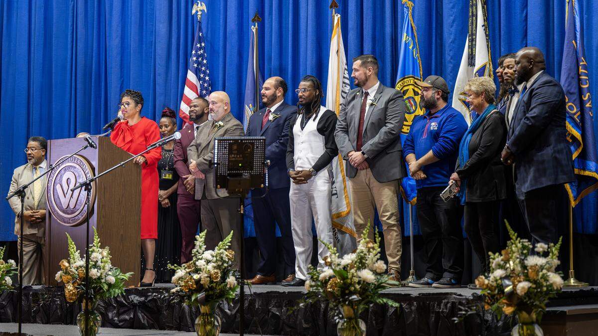 Christal E. Watson welcomes fellow officials to the stage at the conclusion of an inauguration ceremony on Monday, Dec. 15, 2025, at Memorial Hall in Kansas City, Kansas.