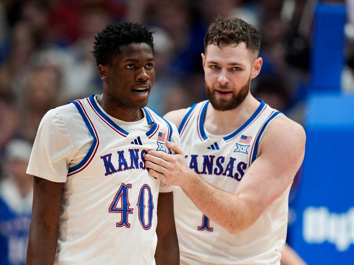 Kansas Jayhawks forward Flory Bidunga, left, and center Hunter Dickinson get ready for action to resume during a college basketball game against the Iowa State Cyclones at Allen Fieldhouse in Lawrence, Kansas, on Monday, Feb. 3, 2025.
