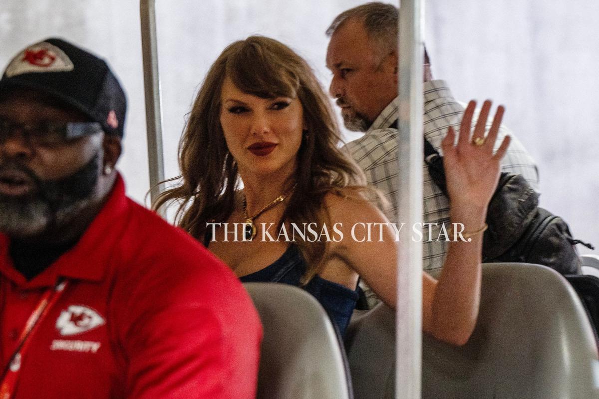 Pop star Taylor Swift waves to people as she is driven down the tunnel in a golf cart before an NFL game between the Kansas City Chiefs and the Baltimore Ravens at GEHA Field at Arrowhead Stadium on Thursday, Sept. 5, 2024.