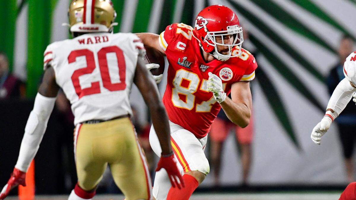 San Francisco 49ers free safety Jimmie Ward and middle linebacker Fred Warner go after Kansas City Chiefs tight end Travis Kelce (87) who ran with a pass during the Chiefs-49ers game in Super Bowl 54 in Hard Rock Stadium in Miami Gardens.