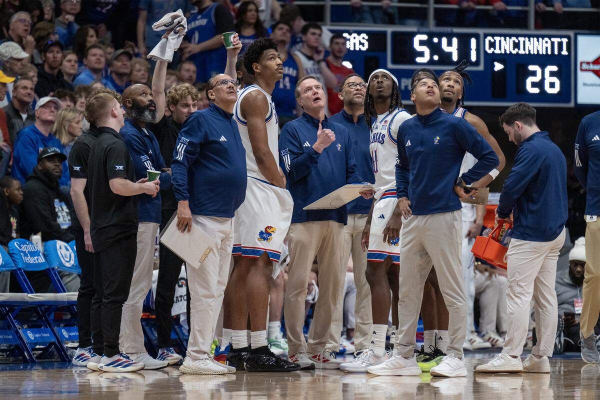 Kansas Jayhawks men’s basketball coach Bill Self watches a replay with the team during the first half of a game against the Cincinnati Bearcats at Allen Fieldhouse on Saturday, Feb. 21, 2026, in Lawrence, Kansas.