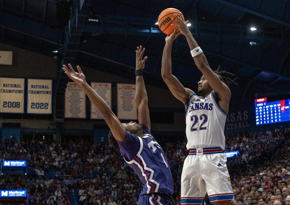 Kansas Jayhawks guard Darryn Peterson (22) gets a 3-point shot off as TCU Horned Frogs guard Jayden Pierre (1) defends in the first half at Allen Fieldhouse in Lawrence on Tuesday, Jan. 6, 2025.