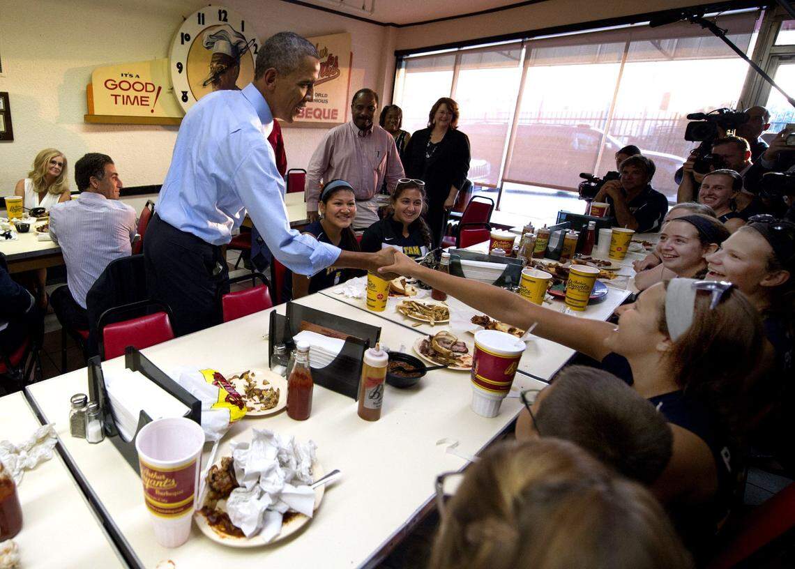 Former president Barack Obama visited at Arthur Bryant’s Barbeque in 2014. The historic building received “extensive” damage when the fire suppression system was activated.