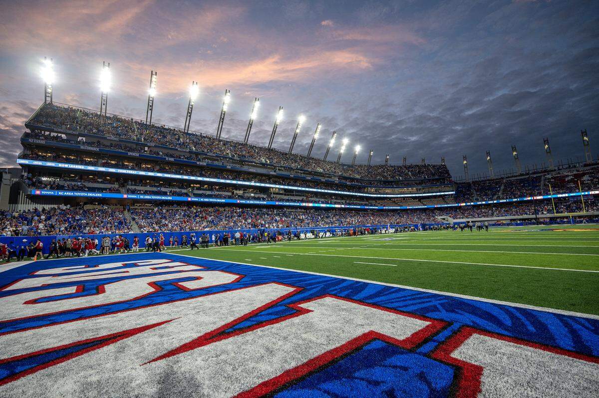 The sun sets over David Booth Kansas Memorial Stadium during a game between Kansas and Wagner on Friday, Aug. 29, 2025, in Lawrence.
