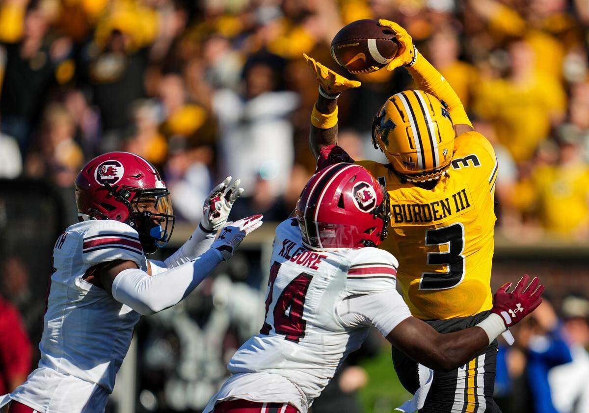 Missouri Tigers wide receiver Luther Burden III hauls in a touchdown pass from Brady Cook during Saturday’s homecoming game against South Carolina at Faurot Field in Columbia.