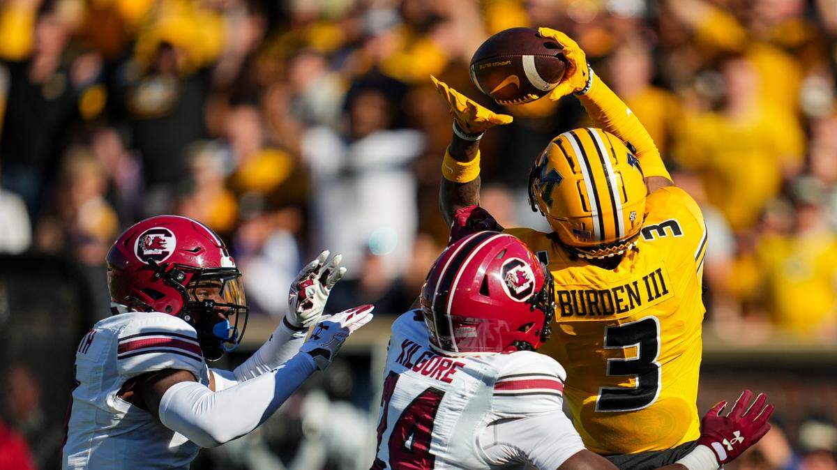 Missouri Tigers wide receiver Luther Burden III hauls in a touchdown pass from Brady Cook during Saturday’s homecoming game against South Carolina at Faurot Field in Columbia.