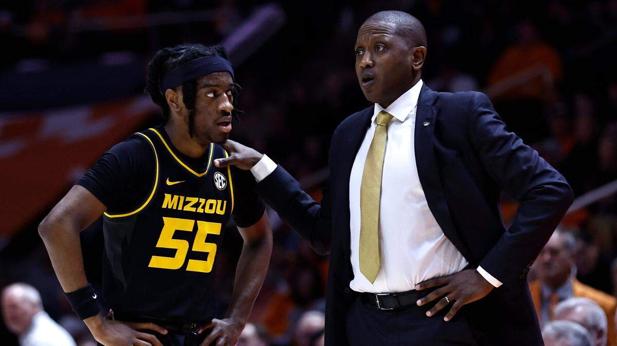 Missouri coach Dennis Gates talks with guard Sean East II during the first half of the Tigers’ last-second stunner against Tennessee on Feb. 11, 2023, in Knoxville, Tenn.