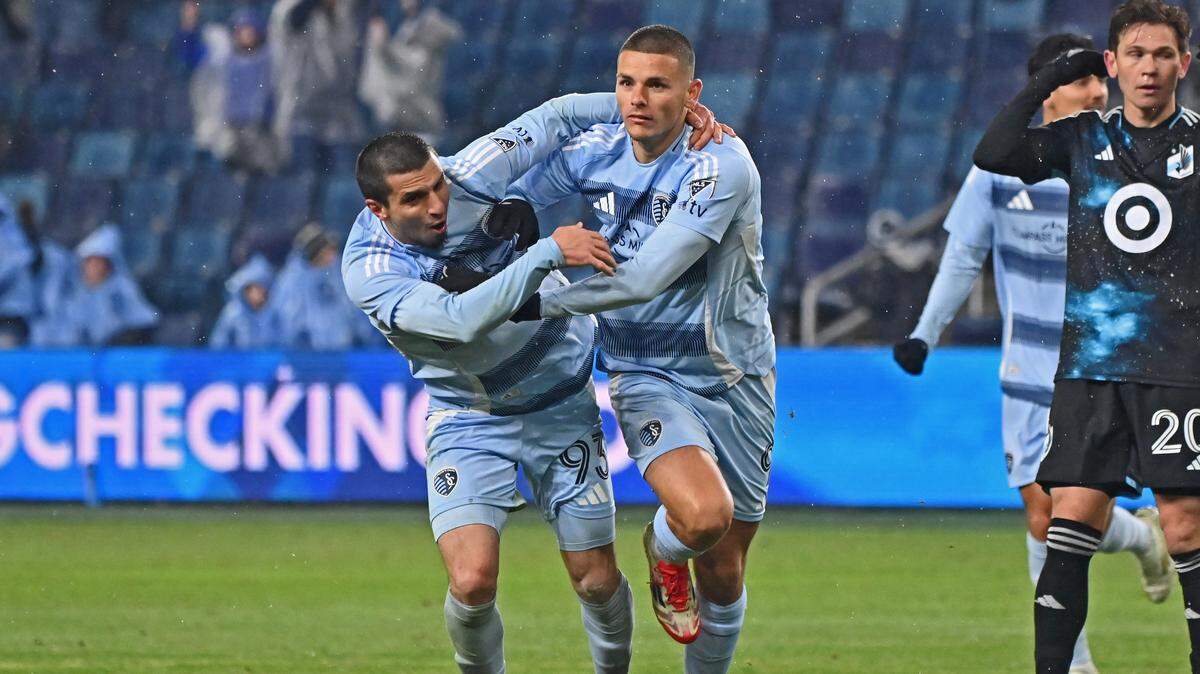 Sporting Kansas City forward Dejan Joveljic (9) celebrates after scoring a goal with teammate Shapi Suleymanov (93) in the second half against Minnesota United at Children’s Mercy Park on March 15, 2025.