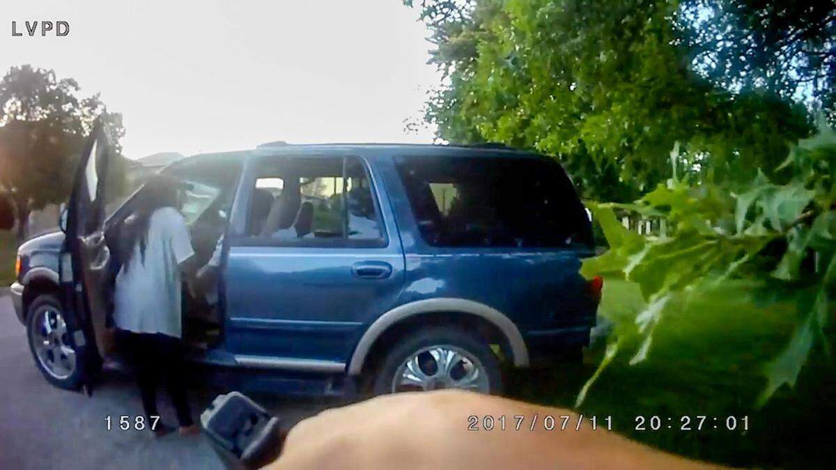 In this image from a body camera, Heather Garcia checks on her husband, Antonio Garcia shortly after he was shot and killed on July 11, 2017, by Michael Harrington, a former officer of the Leavenworth Police Department. Harrington was terminated from the department in January 2018 for violating the department’s use of deadly force policy. A mistrial was declared Wednesday, April 22, 2022, in the trial of Harrington, who was charged with involuntary manslaughter. The Leavenworth Police Department released the body camera video April 23, 2022.