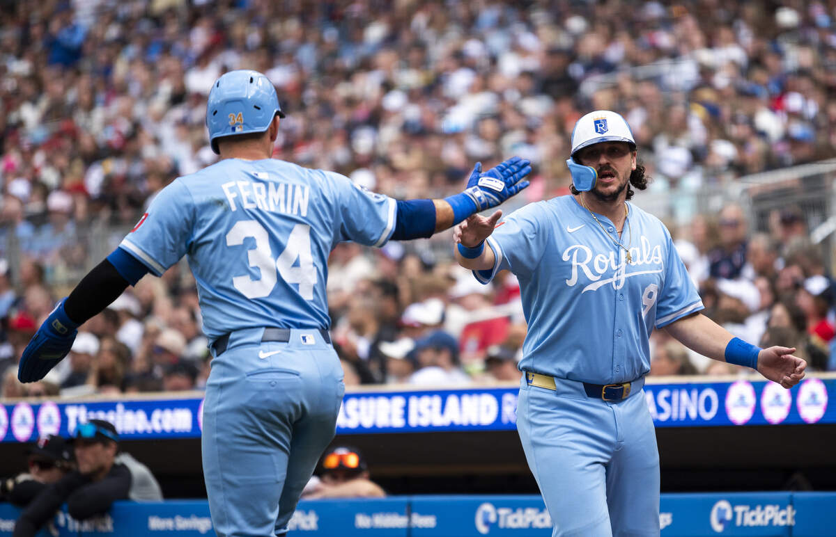Royals first baseman Vinnie Pasquantino and then-KC catcher Freddy Fermin celebrate after scoring against the Minnesota Twins during a game at Target Field in Minneapolis on May 24, 2025.