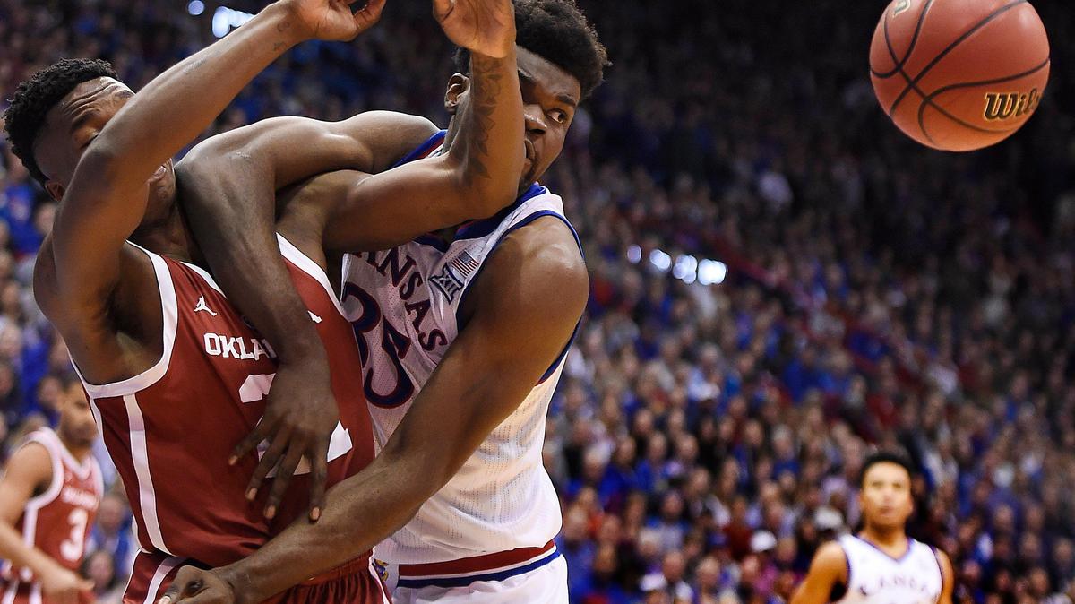 KUâ€™s Udoka Azubuike, right, holds off OUâ€™s Kristian Doolittle while they battle for a rebound during the first half of Wednesday nightâ€™s Big 12 Conference game at Allen Fieldhouse.