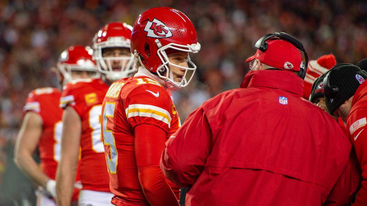 Kansas City Chiefs quarterback Patrick Mahomes speaks to head coach Andy Reid during a timeout at the AFC Championship Game against the Cincinnati Bengals at GEHA Field at Arrowhead Stadium on Sunday, Jan. 29, 2023, in Kansas City.