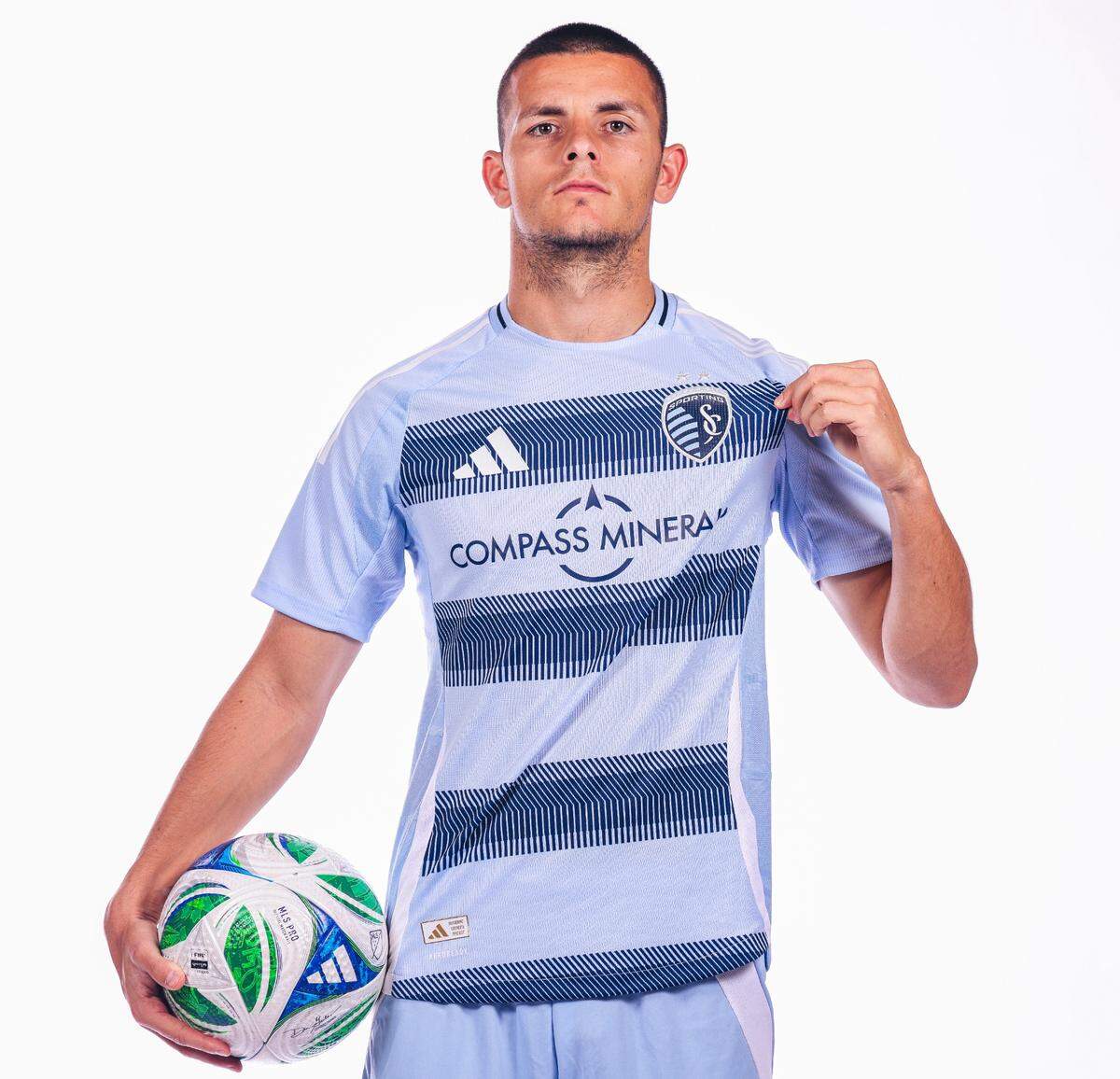 Newly signed for the 2025 season, Sporting Kansas City striker Dejan Joveljic models the club’s new “One KC” primary kit for the upcoming Major League Soccer season campaign.