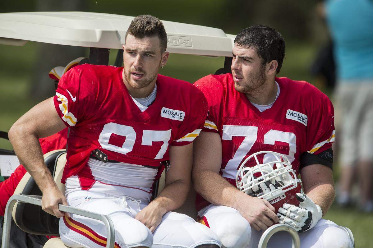 Kansas City Chiefs tight end Travis Kelce (87) and offensive tackle Eric Fisher (72) rode to the locker room on a golf cart following a 2014 practice at Missouri Western State University in St. Joseph.