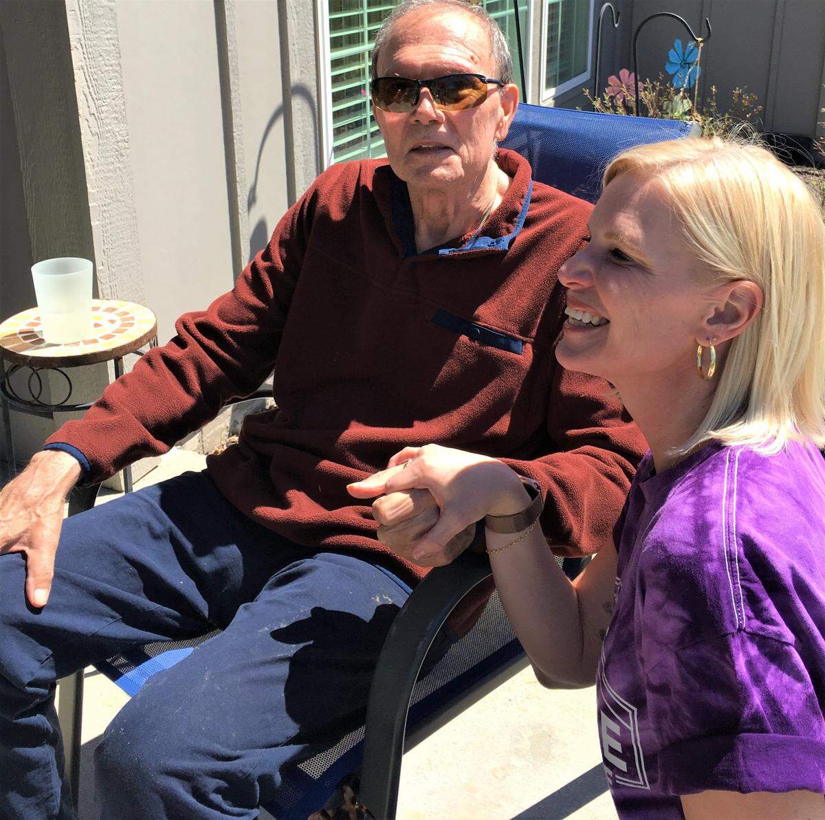 Michala Gibson, co-founder of Prairie Elder Care, chats with resident, Ed Paltani.