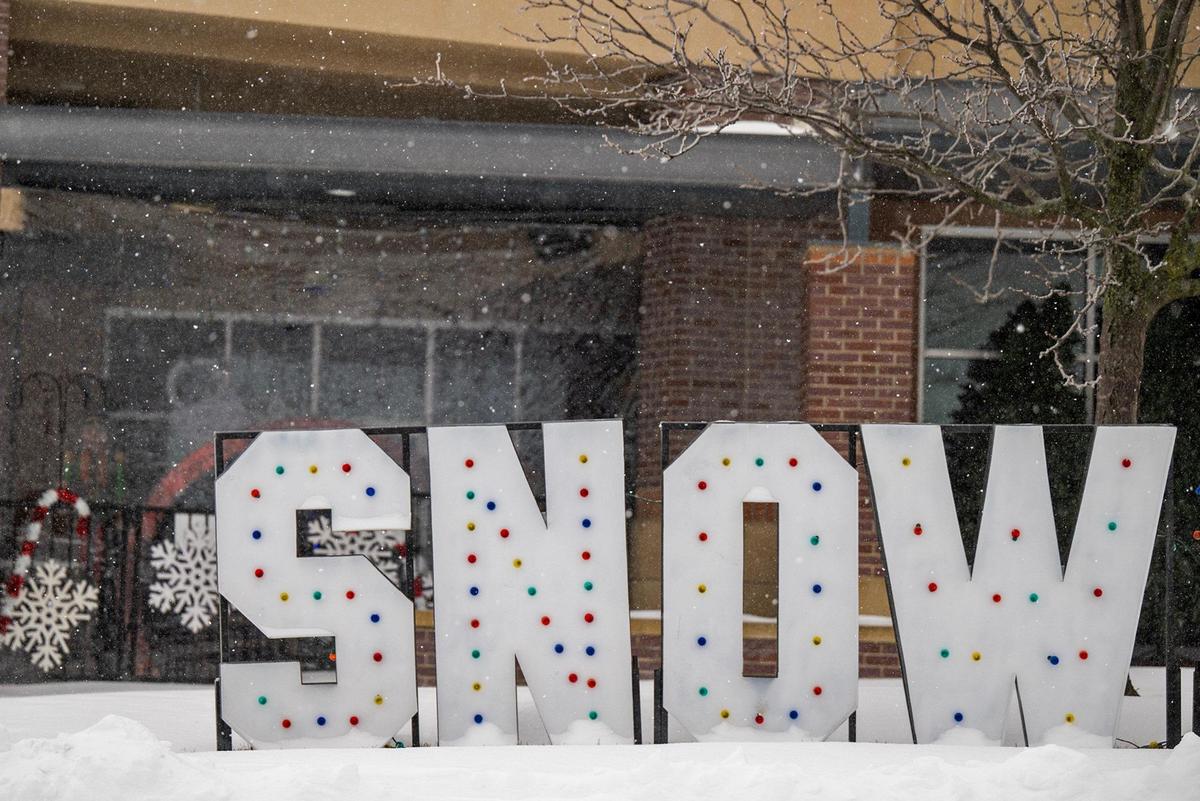 A leftover holiday decoration that reads “SNOW” in large letters seemed fitting amid the blowing snow and blizzard-like conditions during the winter storm that swept through Lenexa on Sunday, Jan. 5, 2025.