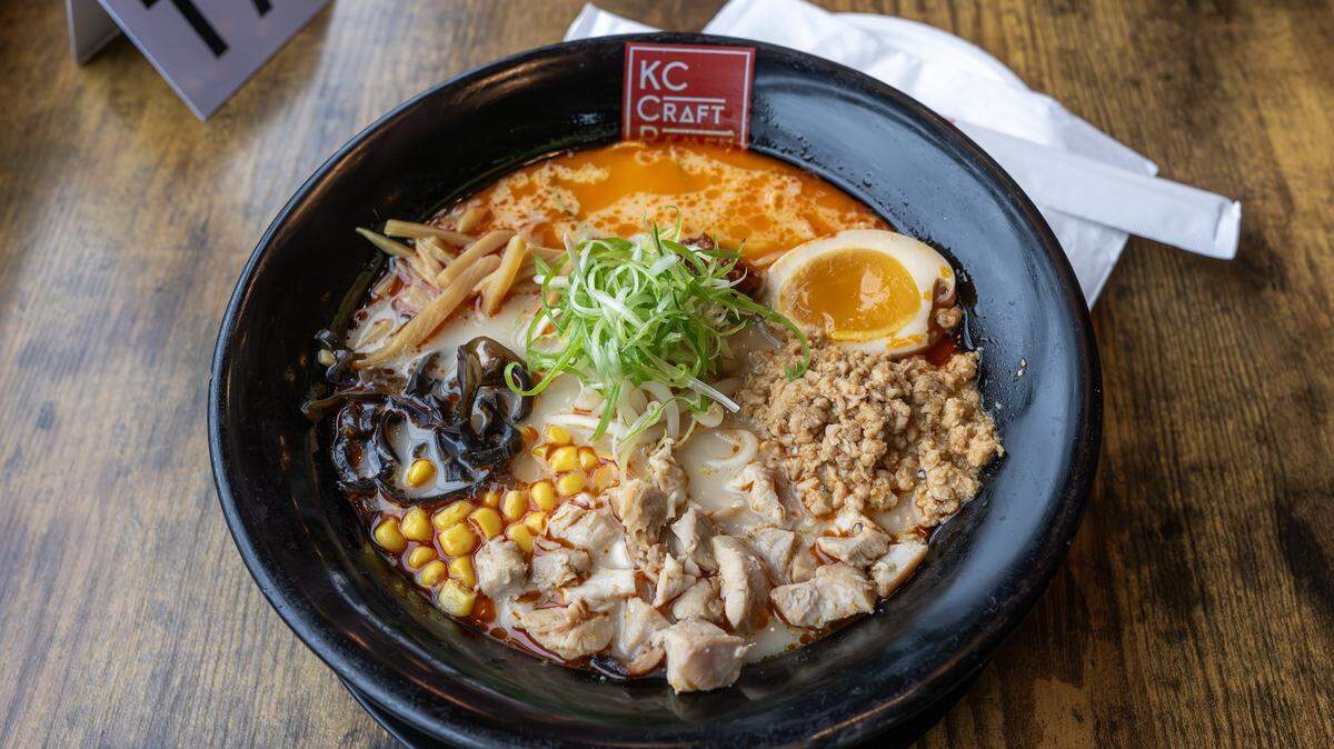 A bowl of Spicy Creamy Chicken ramen sits ready to be served at KC Craft Ramen on Wednesday, Oct. 29, 2025, in Overland Park. The dish includes chicken chashu, chicken mince, bean sprouts, black mushrooms, corn, a seasoned egg, shredded green onions and seasoned bamboo shoots.